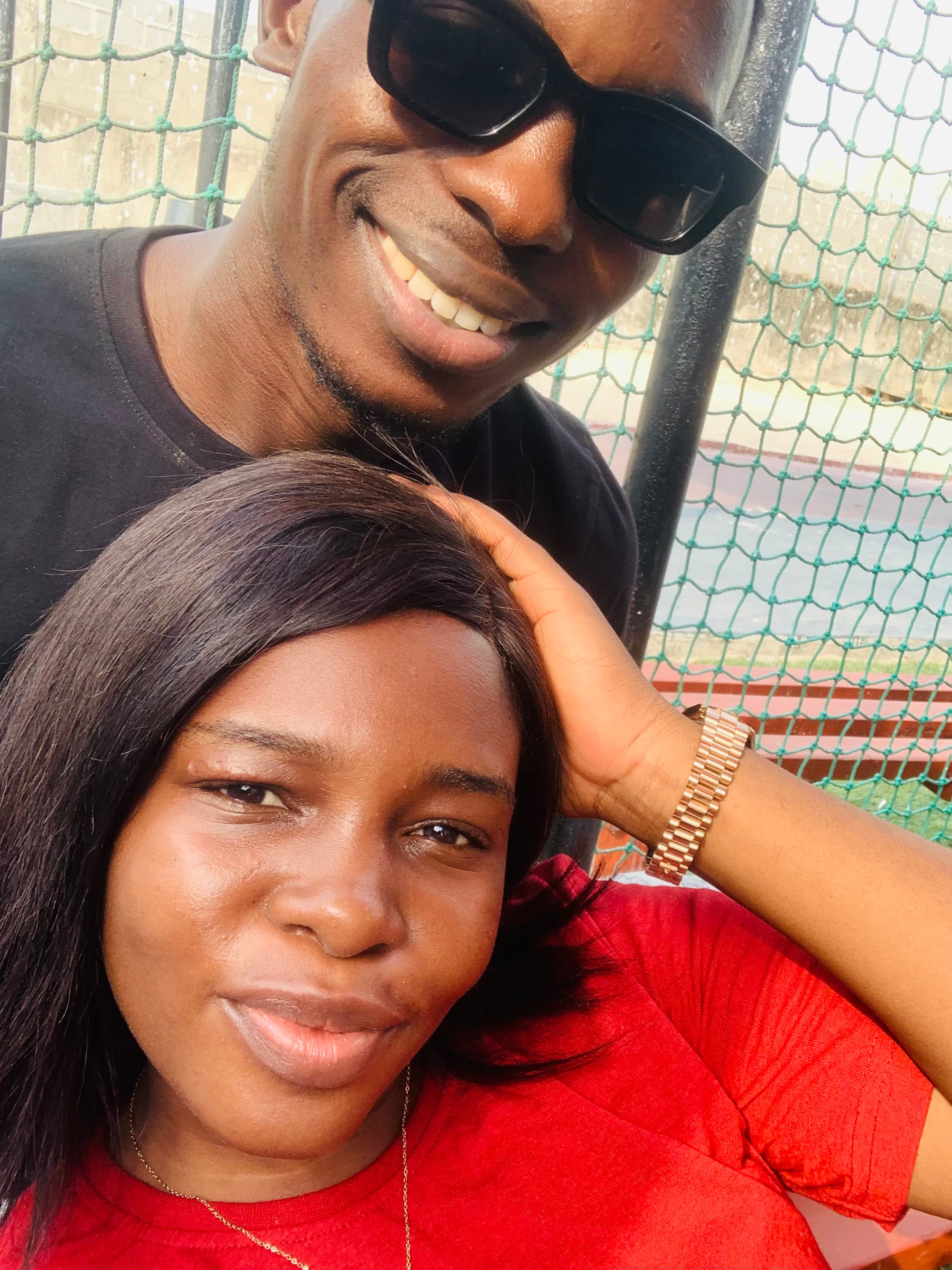 Close-up selfie of Ayo and Ola smiling outdoors
